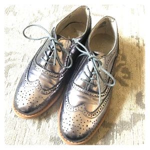 Silver oxford-style shoes